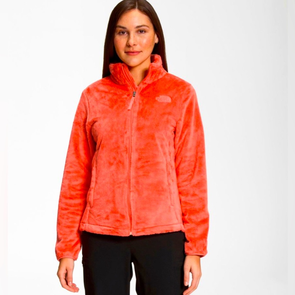 Bright orange fuzzy North Face zip up sweater.